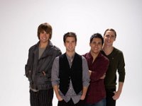 Big Time Rush  Posed shot of the band. Carlos Pena and Jasmes Maslow are wearing black high top chucks.